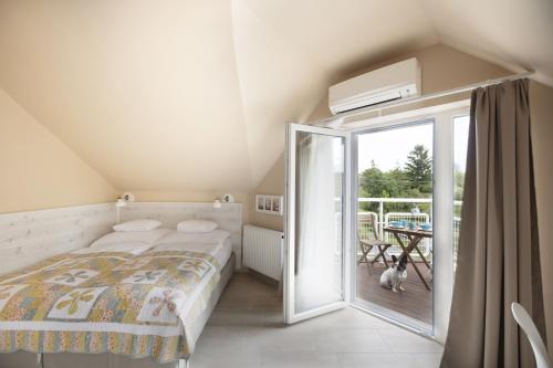 Posteľ alebo postele v izbe v ubytovaní TópART Apartman I