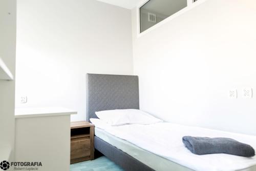 מיטה או מיטות בחדר ב-Hostel Barbórka