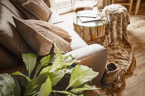a living room with a couch and a table at KitzHome City Apartments in Kitzbühel