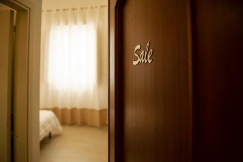 Ένα ή περισσότερα κρεβάτια σε δωμάτιο στο Sole Mare Sale