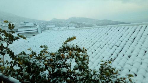 a snow covered roof of a building at Las Casitas de la Esquina in Zahara de la Sierra