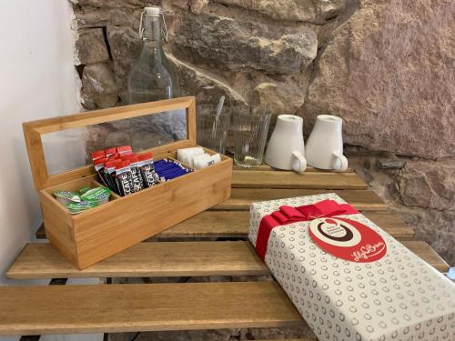 a wooden crate with a box and a bottle at Royal Mile Balconies by the Castle in Edinburgh