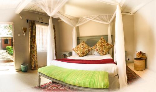 Posteľ alebo postele v izbe v ubytovaní Kongoni Camp