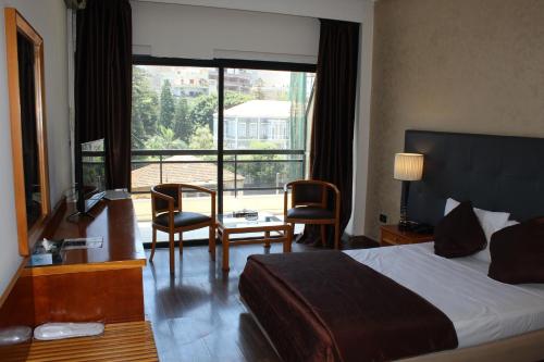 Ένα ή περισσότερα κρεβάτια σε δωμάτιο στο Charles Hotel