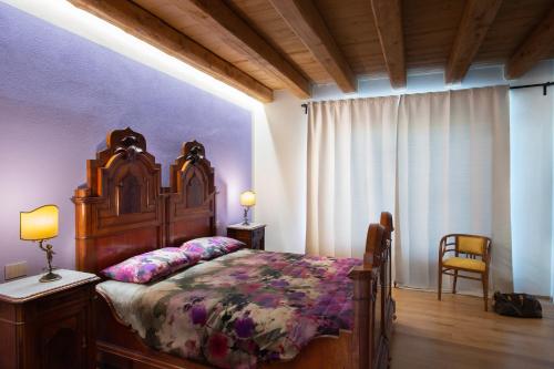 מיטה או מיטות בחדר ב-Relais SANT'AMBROGIO