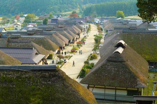 a view of a village with roofs and a street at APA Hotel Fukushima Ekimae in Fukushima