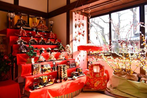 a room with red shelves with christmas ornaments at APA Hotel Fukushima Ekimae in Fukushima