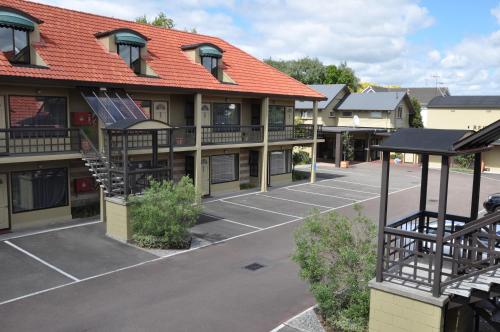 an empty parking lot in front of a building at Rose City Motel in Palmerston North
