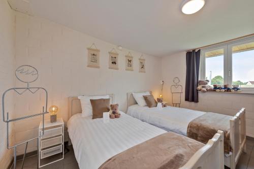 Un pat sau paturi într-o cameră la Vlaeberg Cottage