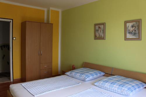 Postel nebo postele na pokoji v ubytování Aura
