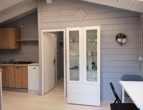 a kitchen with an open door to a refrigerator at Lido di Sesto in Sesto Calende