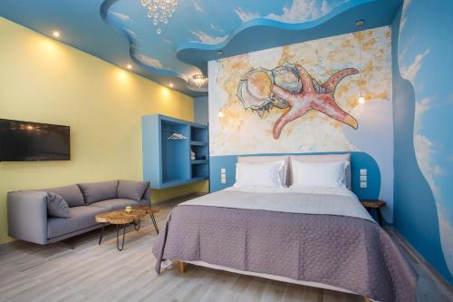 a bedroom with a bed with a painting on the wall at Haven Beach in Faliraki