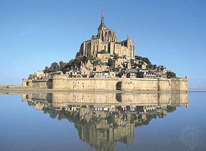 a large castle on an island in the water at hotelF1 Avranches Baie Du Mont Saint Michel in Saint-Quentin-sur-le-Homme