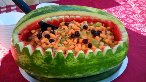 a watermelon cut in half with vegetables in it at Chambres d'hôtes Les Iris in Sospel