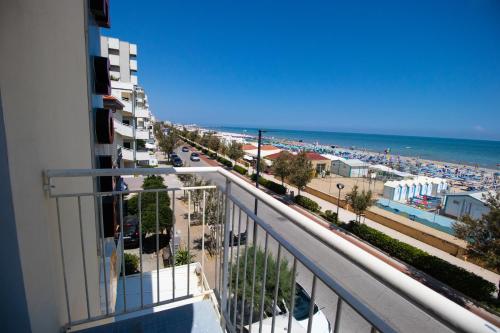 a view of the beach from a balcony of a building at Hotel B&B Sole in Senigallia