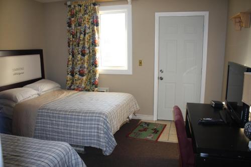 Cama o camas de una habitación en Kent Motel