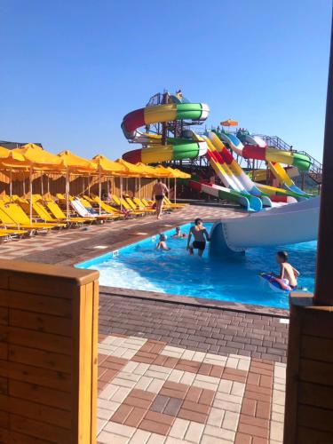 a group of people in a pool at a water park at Глухомань Аквапарк in Poltava