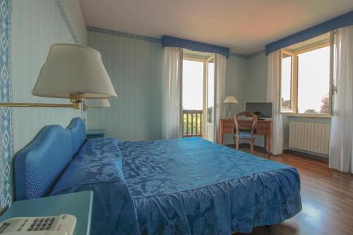Postel nebo postele na pokoji v ubytování Hotel Moderno