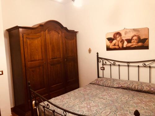 Ein Bett oder Betten in einem Zimmer der Unterkunft 50 sfumature dell'Arcobaleno
