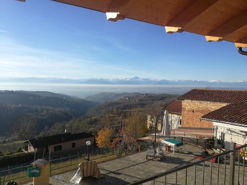 a view of a valley with mountains in the distance at Villa Belvedere Langhe in Belvedere Langhe