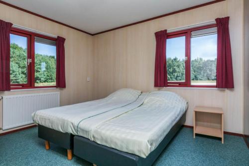 מיטה או מיטות בחדר ב-HH van Craenwick Appartement