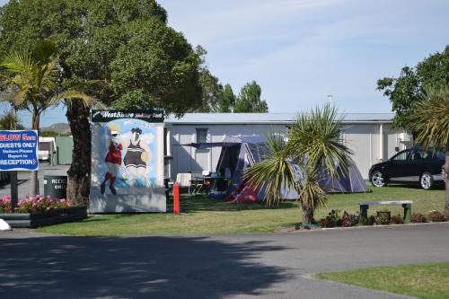 a building with a painting on the side of it at Westshore Holiday Park in Napier