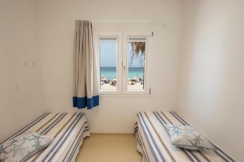 Un ou plusieurs lits dans un hébergement de l'établissement Villa Acquamarina sul mare