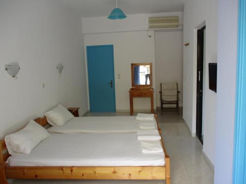 En eller flere senge i et værelse på Iliotropio Ligia