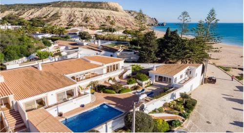 an aerial view of a house on the beach at Casa Bom Porto in Luz