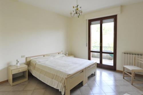 מיטה או מיטות בחדר ב-Tommaso 3 Sopra