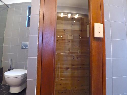 a wooden shower in a bathroom with a toilet at Luxury Villa with Private Pool in Keratea