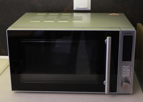 a microwave with a green top on top of it at Central Number 10 in Néa Péramos