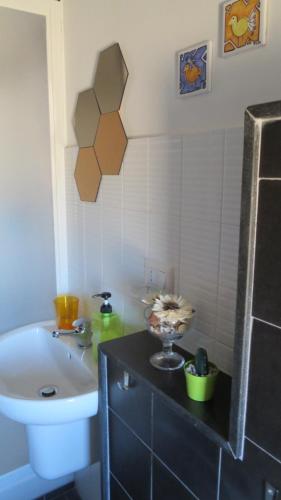 a bathroom with a sink and a toilet and a sink at Idria B&B in Barcellona-Pozzo di Gotto