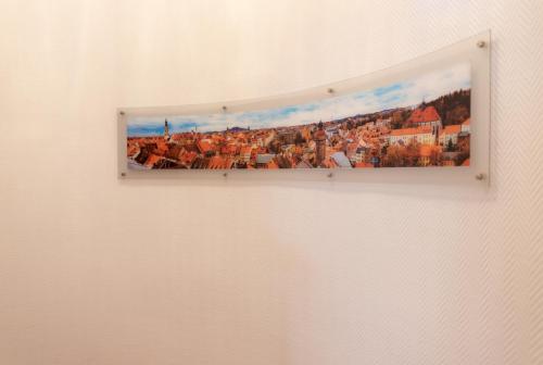 a picture of a city on a wall at Hotel Europa in Görlitz