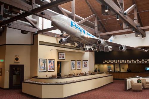 an airplane hanging from the ceiling of a museum at Airtel Plaza Hotel in Van Nuys