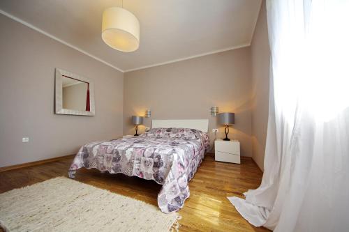 Ένα ή περισσότερα κρεβάτια σε δωμάτιο στο Apartman Marija