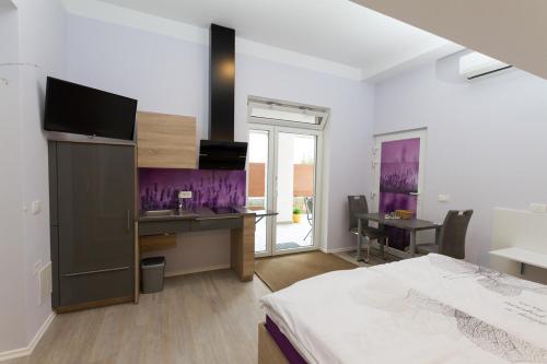 a bedroom with a bed and a desk with a desk at Apartmaji Sobe Zvezda in Pobegi
