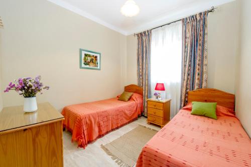 Postel nebo postele na pokoji v ubytování aloha apartments
