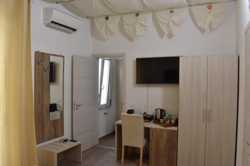 Televízia a/alebo spoločenská miestnosť v ubytovaní B&B Vicomare