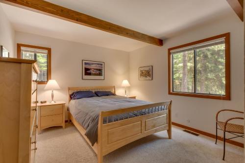 a bedroom with a bed and a window at Daybreak Retreat in Carnelian Bay