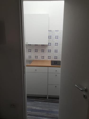 a kitchen with a counter top and a window at Lipari Suite Apartament in Lipari