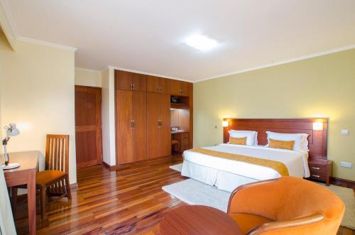 Ένα ή περισσότερα κρεβάτια σε δωμάτιο στο Waridi Paradise Hotel and Suites