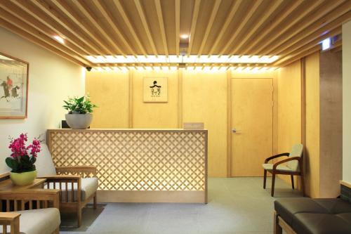 a lobby with a waiting room with a table and chairs at Dream House in Seoul