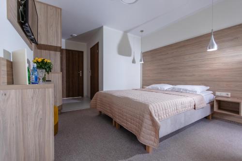 Katil atau katil-katil dalam bilik di Matusz Apartamenty