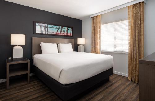 A bed or beds in a room at Hyatt House Denver Tech Center