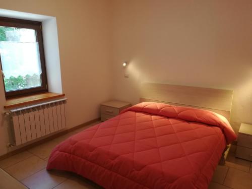 Giường trong phòng chung tại Appartamento Lo Slittone