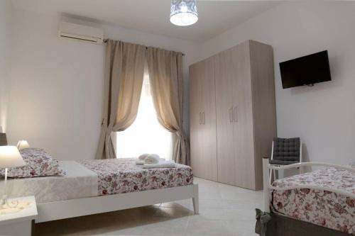 Posteľ alebo postele v izbe v ubytovaní La Casa di Ninetta Amalfi Coast