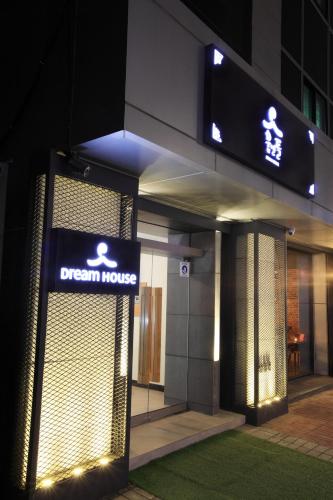 a sign on the side of a building with a dream house at Dream House in Seoul