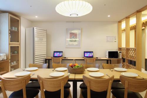 a dining room with a table and chairs at Dream House in Seoul