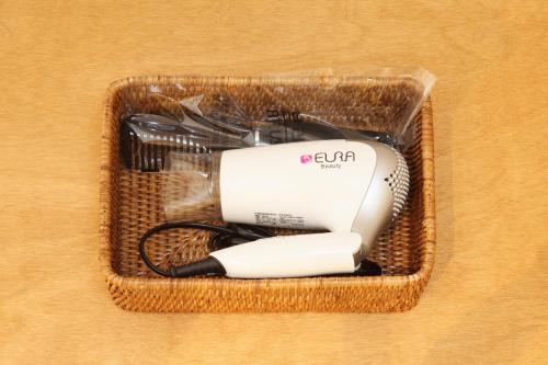 a wicker basket with a hair dryer in it at Dream House in Seoul